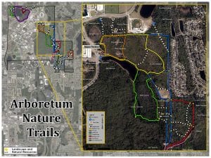 Satellite image of arborretum nature trails with marked paths and legend showing trail types, surrounded by urban areas.
