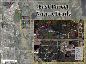 Aerial map showing the east parcel nature trails with color-coded trails and nearby urban areas, including a legend for trail navigation.